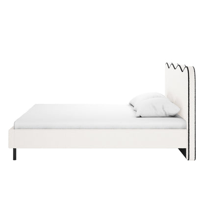 Kaylie Queen Boucle Fabric Bed Frame in White & Black features a minimalist design with a low-profile white upholstered frame and headboard, accented by black trim, on slim black metal legs.