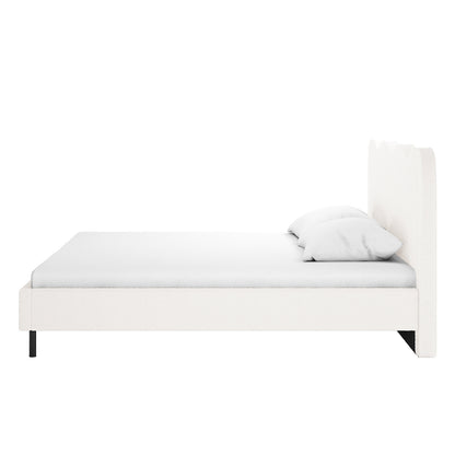 Kaylie Queen Boucle Fabric Bed Frame in Cream White featuring all-white upholstery, a subtly scalloped headboard, low-profile frame with slender black metal legs, complemented by a simple mattress and two white pillows.
