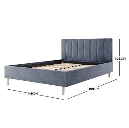 Kelly Double Velvet Bed Frame – Grey features a sleek rectangular headboard with vertical channel tufting in luxurious velvet, complemented by mid-century-inspired tapered legs, showcasing a stylish and sophisticated design.