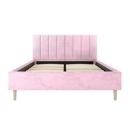 Kelly Double Velvet Fabric Bed Frame in Pink with a tall, channel-tufted headboard, low side and foot rails, exposed wooden slats, and short wooden legs, designed for a double mattress.
