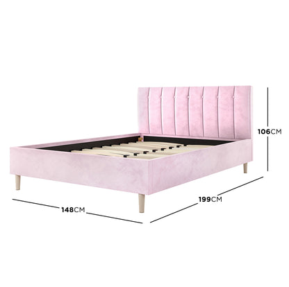 Kelly Double Velvet Fabric Bed Frame in Pink features a tall, vertically-paneled headboard, four wooden legs, and wooden slats for mattress support, creating a stylish, modern bedroom centerpiece.