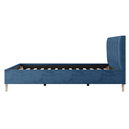 Kelly King Single Velvet Bed Frame - Ocean Blue features a velvet-upholstered headboard with vertical channel tufting, supported by tapered wooden legs, offering a stylish and durable addition to a bedroom.
