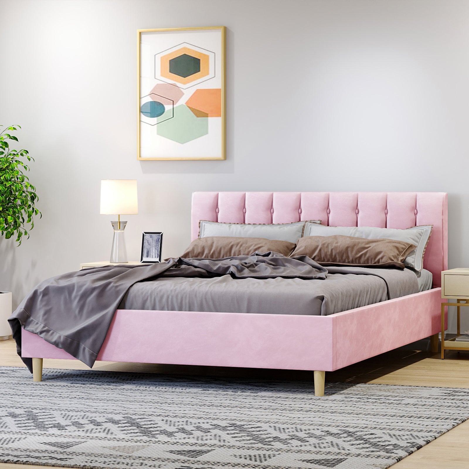 Kelly Queen Velvet Fabric Bed Frame in Pink, featuring a tufted headboard, set in a serene bedroom with grey bedding, elegant nightstand, potted plant, and abstract wall art above.