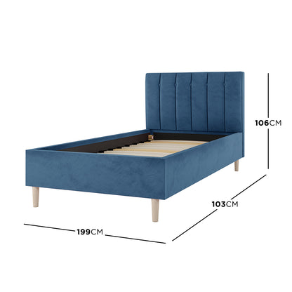 Kelly Single Velvet Bed Frame - Ocean Blue, featuring a sleek headboard with vertical channel tufting and mid-century wooden legs, offering a luxurious touch to compact bedrooms.