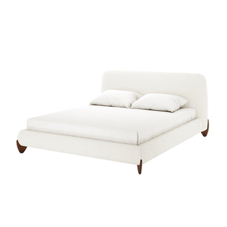 Laryn Queen Plush Boucle Cloud Bed Frame in Cream White features a gently curved headboard and simple platform, upholstered in soft boucle fabric. It includes matching pillows and sits on tapered wooden feet.