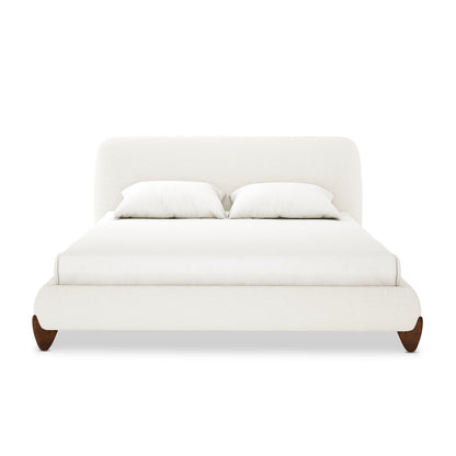 Laryn Queen Plush Boucle Cloud Bed Frame in Cream White features a low-profile platform, softly rounded upholstered headboard and frame, dressed in white bedding, resting on gently curved wooden legs.