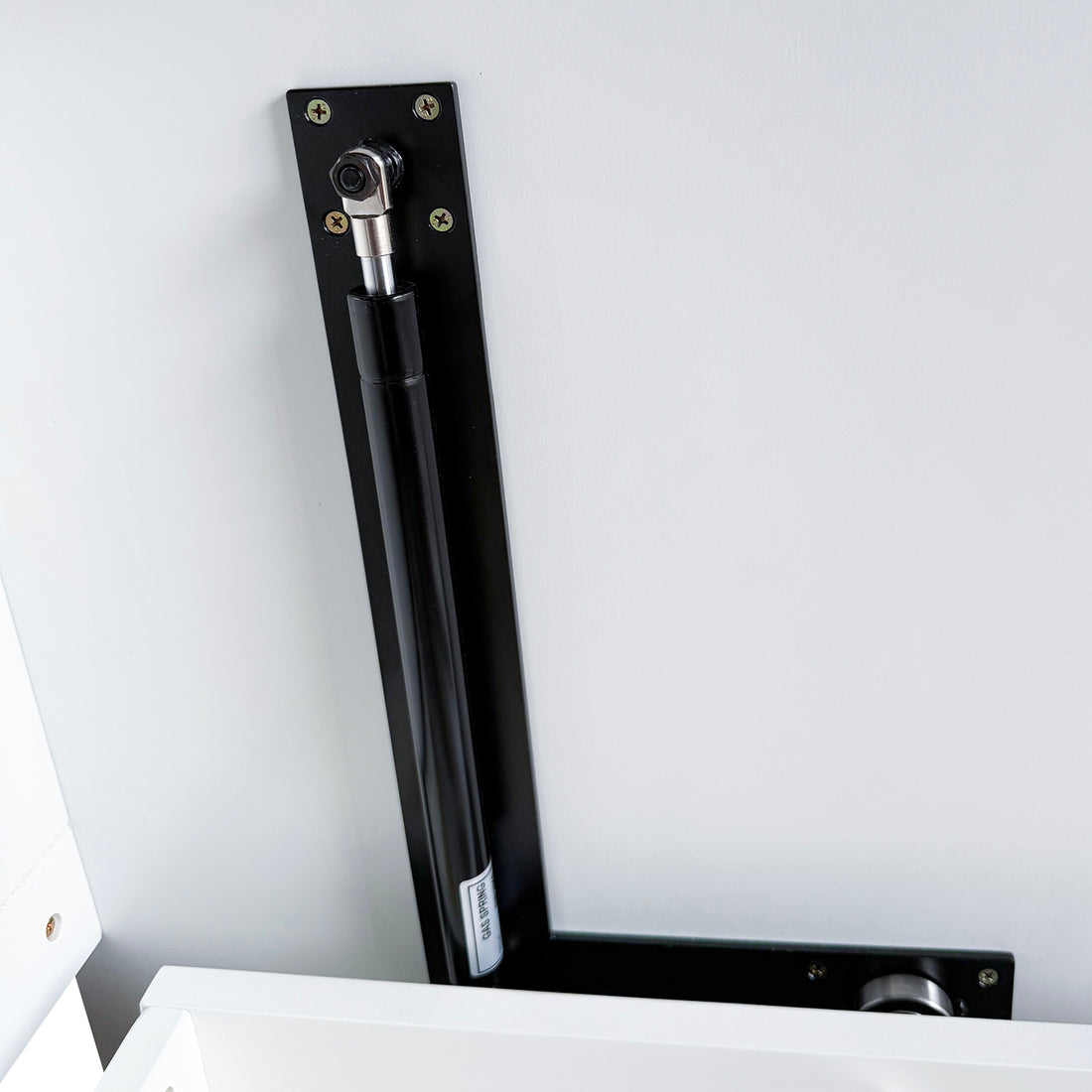 Close-up of the Leeton Space-Saving Queen Foldout Wall Bed's gas-spring hinge assembly, showcasing the black metal mounting plate and gas-filled piston for smooth panel motion control and secure positioning.