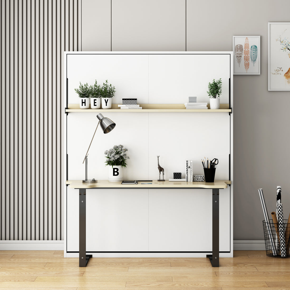 Logan Queen Space Saving Foldout Wall Bed & Desk in White: A versatile fold-up design with oak-accented desk and shelf, featuring potted plants, books, and decorative items for a modern, minimalist home office setup.