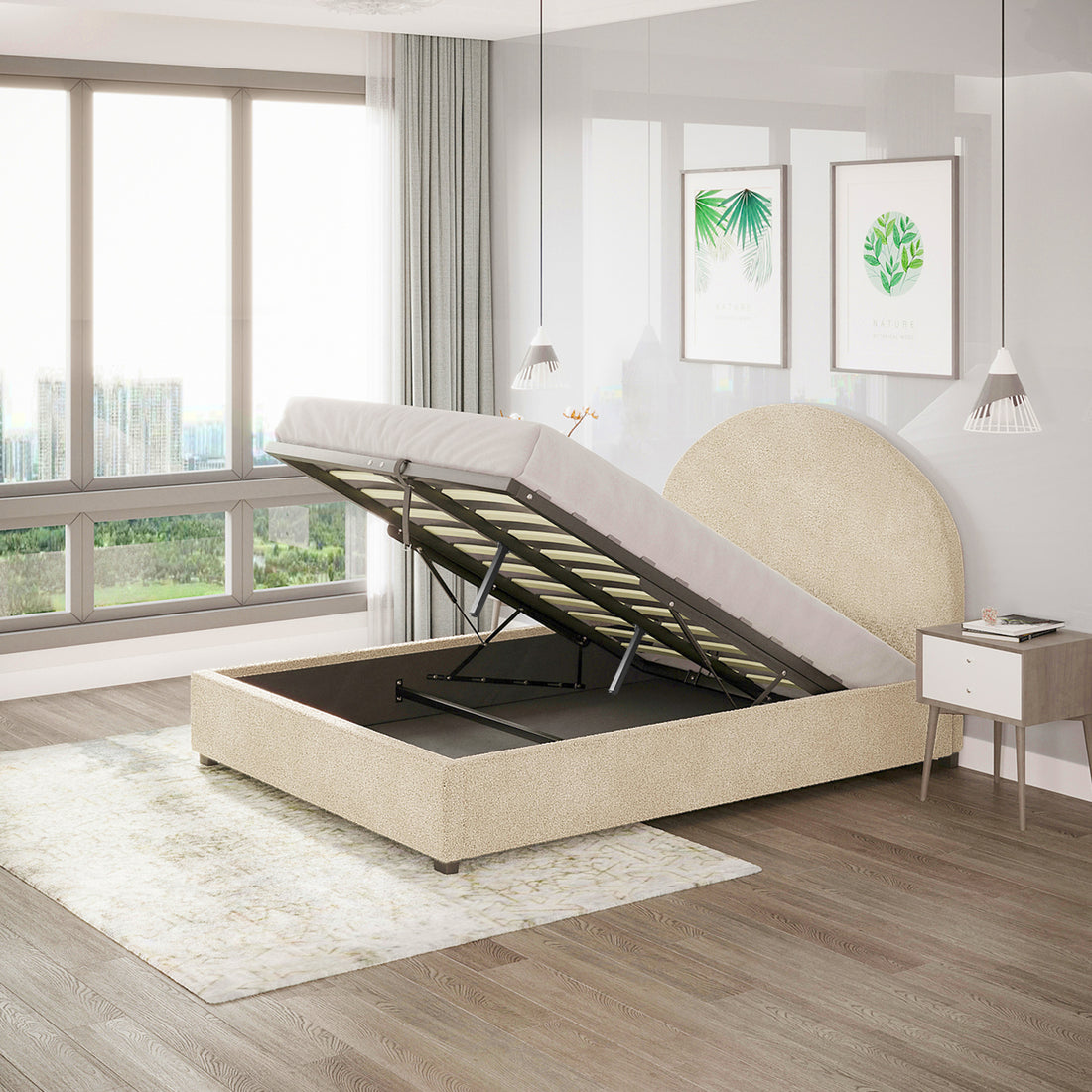Lunia Double Boucle Gas Lift Storage Bed Frame in Cream Beige with a rounded headboard, shown open to reveal under-bed storage, alongside a light wood nightstand and botanical prints above.
