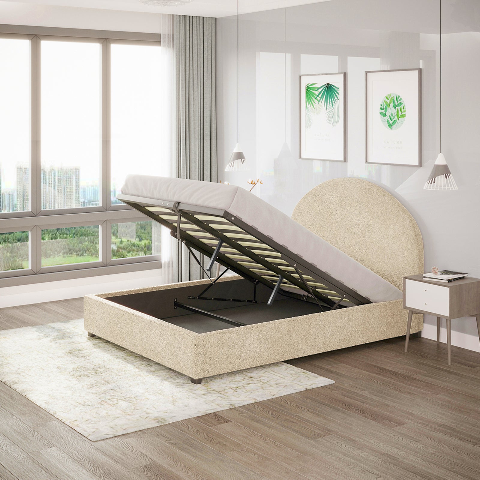 Lunia Double Boucle Gas Lift Storage Bed Frame in Cream Beige with a rounded headboard, shown open to reveal under-bed storage, alongside a light wood nightstand and botanical prints above.