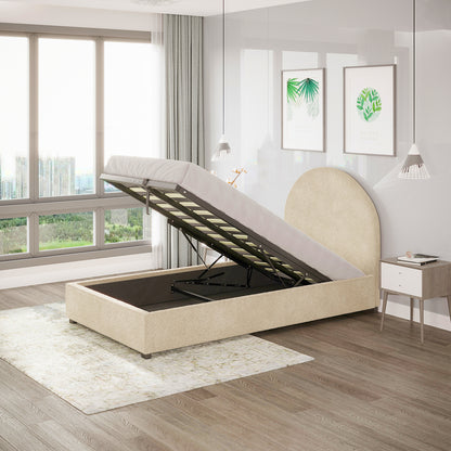 Lunia Bouclé Bed Frame in Cream Beige features a gas-lift mechanism revealing under-bed storage, set in a light-filled room with mid-century decor, pendant lights, and botanical prints.