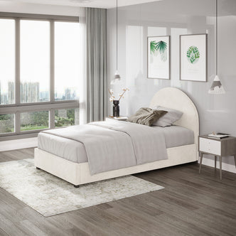 Lunia Single Bouclé Bed Frame with Gas Lift Storage in a contemporary bedroom, featuring neutral-gray bedding, a mid-century bedside table with books, pendant lamps, and botanical prints above.