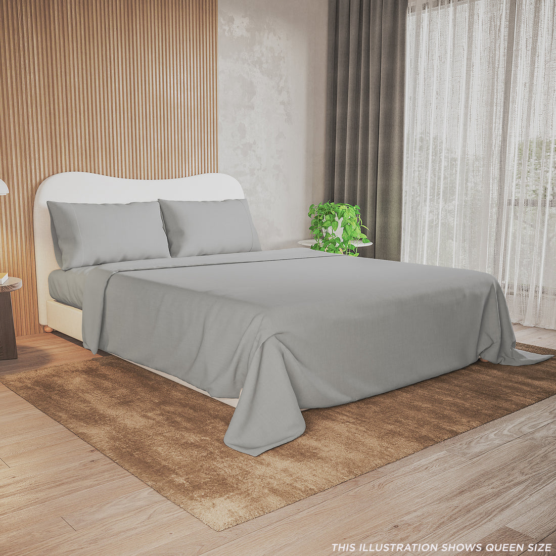 Close-up of the Valeria 1000TC Ultra Soft Bed Sheet Set – Light Grey (King), highlighting the smooth texture and premium fabric on a bed, accompanied by a white pillow and a potted plant nearby.