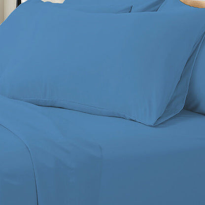 Valeria King Single 1000TC Ultra Soft Bed Sheet Set in Blue; close-up of bed with solid blue fitted sheet and matching pillowcase, showcasing luxurious, smooth fabric texture and neat arrangement.