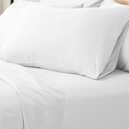Valeria 1000TC Ultra Soft Bed Sheet Set King Single – White, featuring smooth, neatly laid white sheets on a bed, complemented by a neatly placed pillow and cushion, highlighting luxury and comfort.
