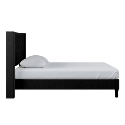 Maggie Double Winged Fabric Bed Frame – Black, featuring a plush, deep-buttoned Chesterfield headboard and a sturdy frame, offering elegance and support for a refined bedroom centerpiece.