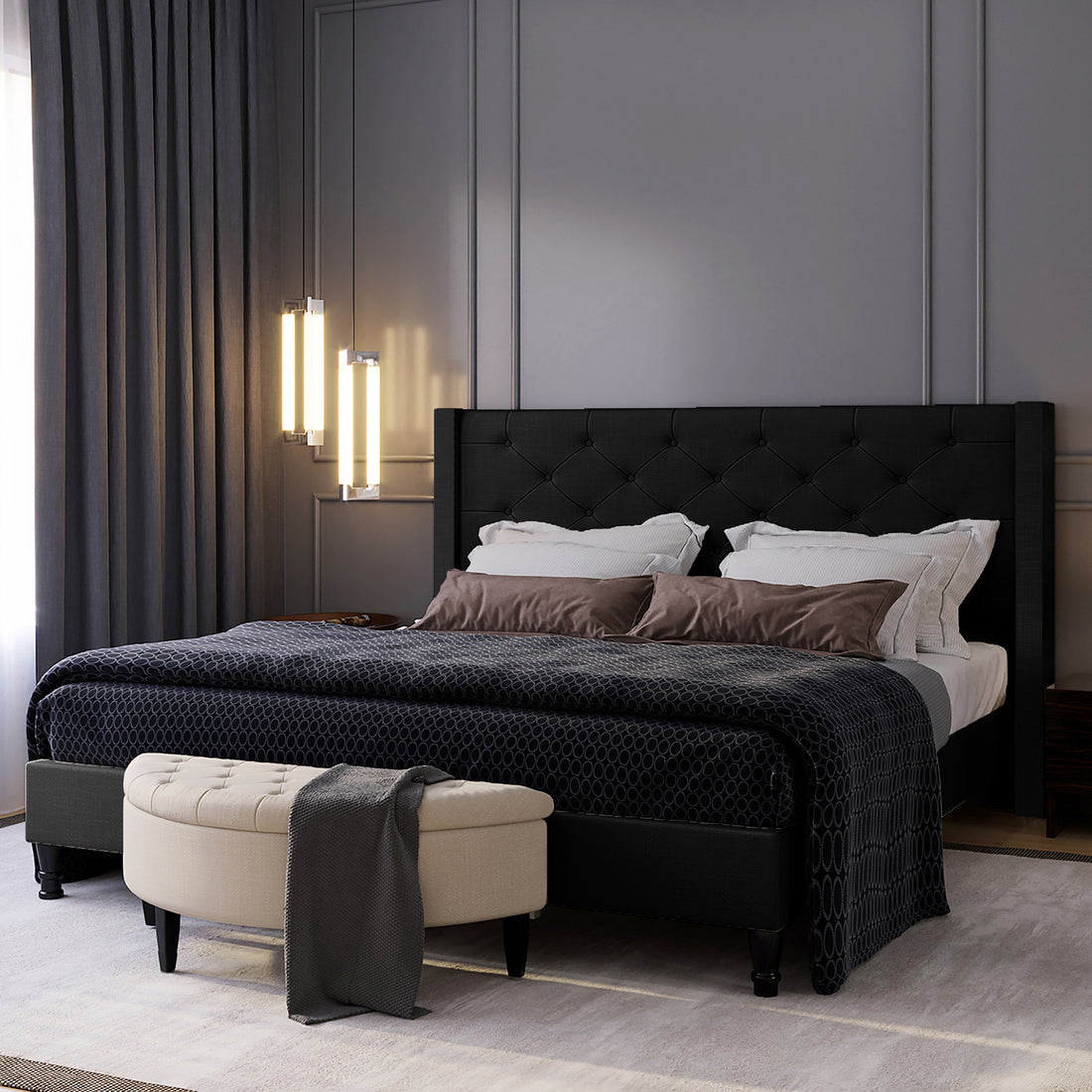Maggie King Winged Fabric Bed Frame – Black with a grand Chesterfield-style headboard, showcasing deep-buttoned design and plush upholstery, highlighted in a close-up of bed and light details.