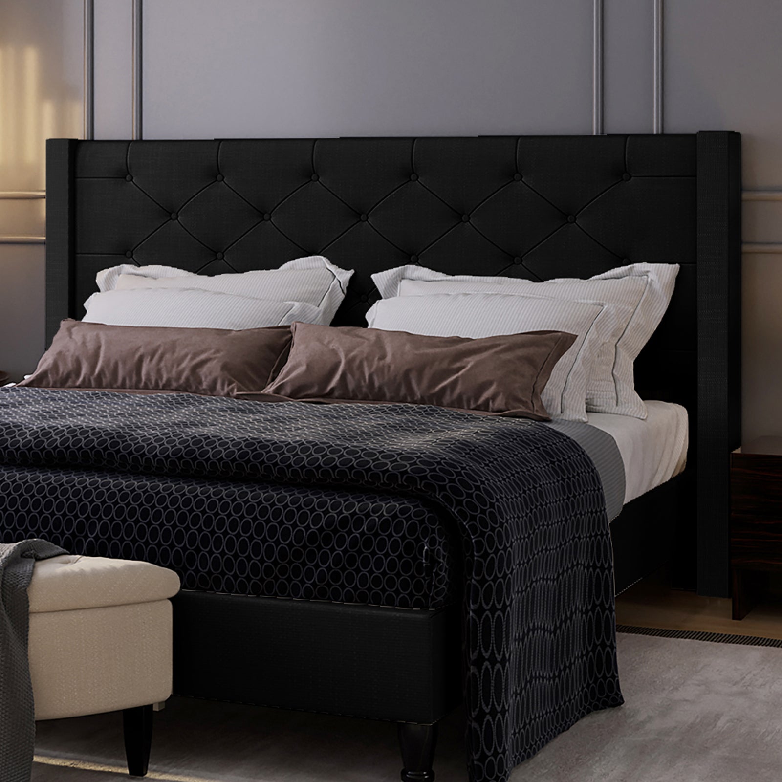 Maggie King Winged Fabric Bed Frame – Black features a grand Chesterfield-style headboard with deep-buttoned detailing, crafted in plush fabric, showcasing a sophisticated blend of classic and contemporary design.