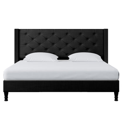 Maggie King Winged Fabric Bed Frame – Black, featuring a grand Chesterfield-style headboard with deep-buttoned upholstery and plush fabric, offering a sophisticated, elegant look for any bedroom.