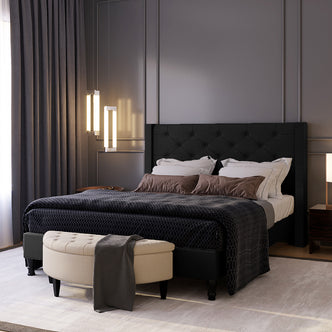 Maggie Queen Winged Fabric Bed Frame – Black features a deep-buttoned Chesterfield headboard and durable construction with solid timber and metal legs, offering a luxurious and supportive focal point for any bedroom.