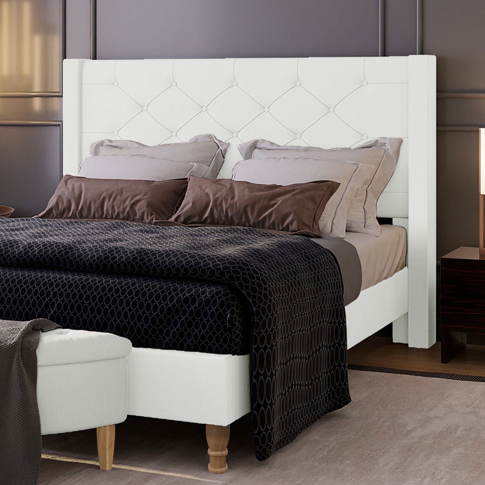 Maggie Queen Winged Fabric Bed Frame in Off White, featuring a button-tufted headboard, neutral-tone bedding, dark accent pillows, and a subtle patterned bedspread, enhancing a serene bedroom corner.