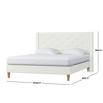 Maggie Queen Winged Fabric Bed Frame in Off White features a tall, diamond-tufted headboard, white upholstery, and turned wooden legs. Dimensions: 171.5 cm wide, 221 cm long, 120 cm tall.