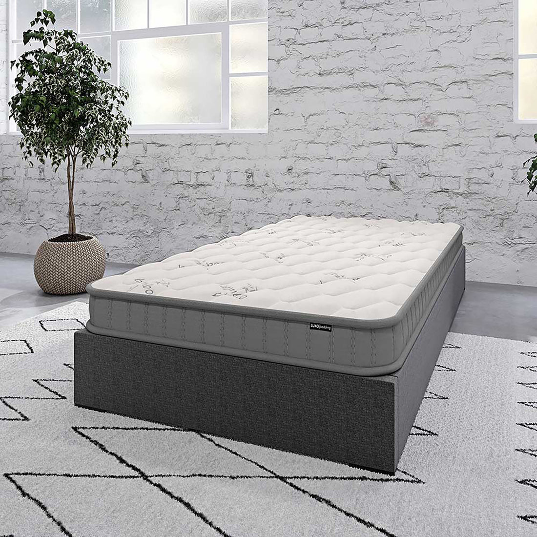 Asteria Single 18cm Pocket Spring Latex Mattress in Medium on a dark gray upholstered bed base, showcasing its quilt-tufted design, perfect for minimalist, modern bedrooms with industrial accents.