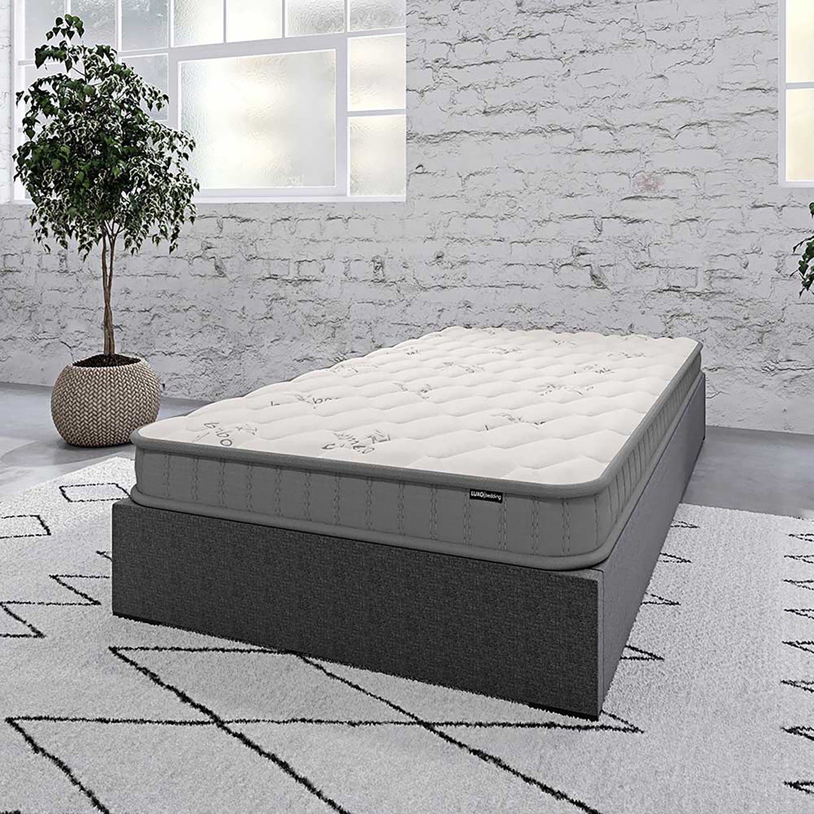 Asteria Single 18cm Pocket Spring Latex Mattress in Medium on a dark gray upholstered bed base, showcasing its quilt-tufted design, perfect for minimalist, modern bedrooms with industrial accents.