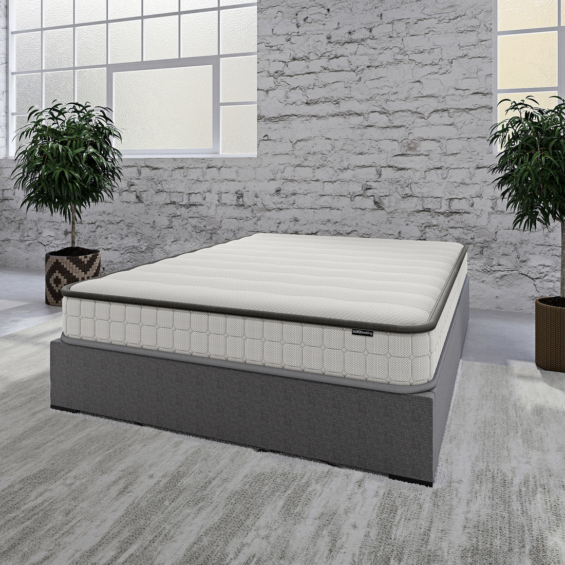 Cybele Double 20cm Pocket Spring Memory Foam Mattress sits on a gray platform bed in a minimalist bedroom, featuring a quilted top and surrounded by tall green plants and frosted-glass windows.