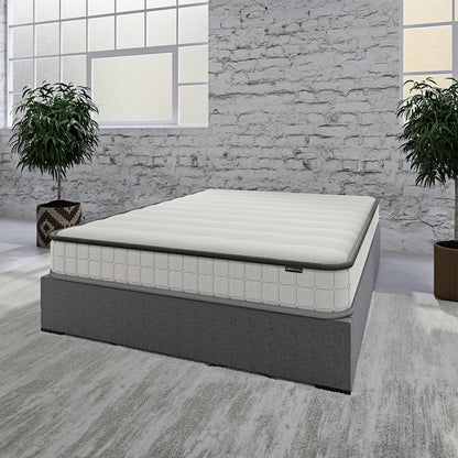 Cybele Double 20cm Pocket Spring Memory Foam Mattress sits on a gray platform bed in a minimalist bedroom, featuring a quilted top and surrounded by tall green plants and frosted-glass windows.