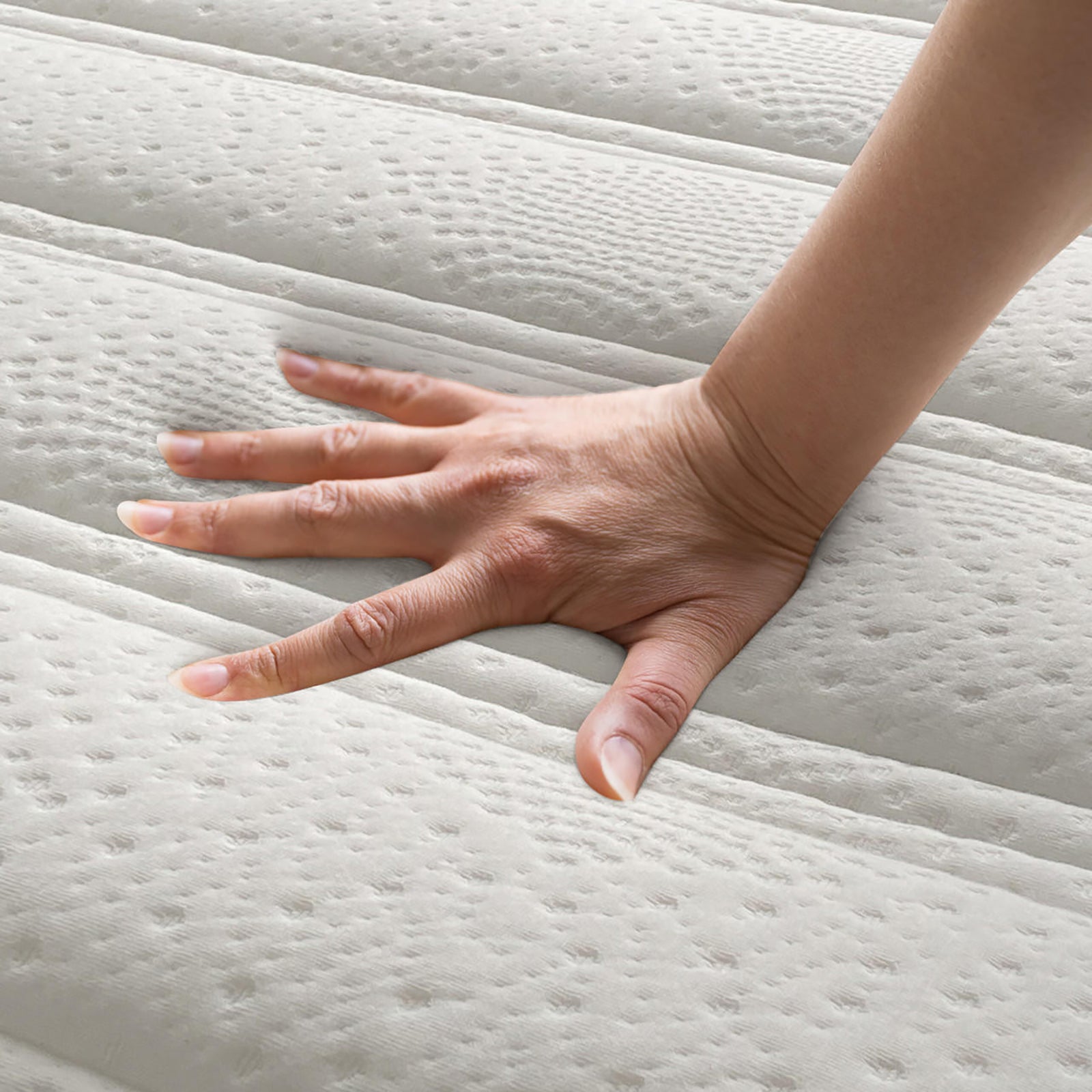 Delia Queen 28cm Medium Firm Euro Top Latex Mattress – White, showing a hand pressing the plush Euro top quilting, highlighting its luxurious cushioning and supportive nine-layer construction for ultimate comfort.