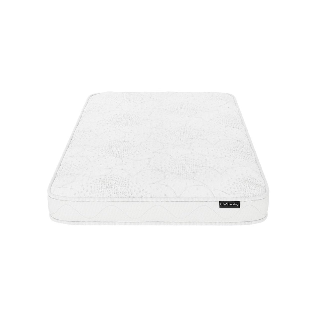 Gydas 10cm High-Density Foam Knitted Nursery Cot Mattress features a plain white, quilted top, and a Luxol Bedding label, showcasing its new, unmade state on a white background.