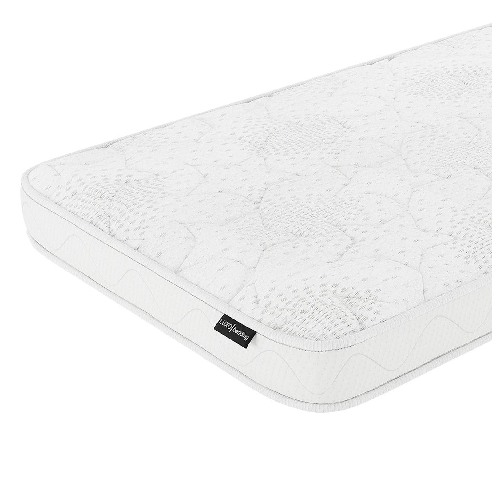 Gydas 10cm High-Density Foam Knitted Nursery Cot Mattress with quilt-patterned surface, viewed at an angle, showcasing stitched details and side label for gentle comfort and certified safety.