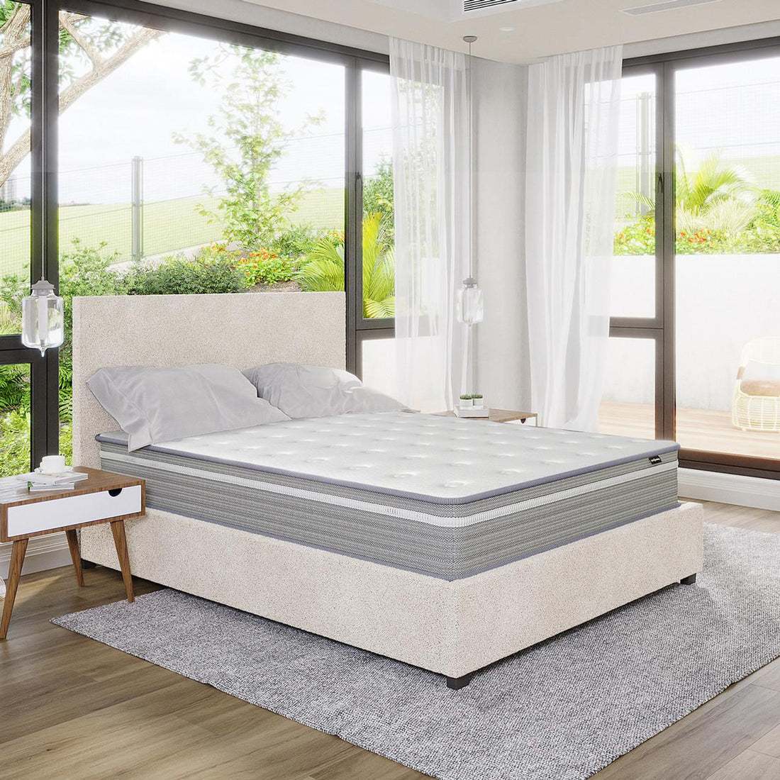 Oriona Double 25cm Pocket Spring Gel Mattress in Medium Firm on a low-profile upholstered bed, showcasing a tufted design, complemented by mid-century nightstands and glass pendant lights in a bright bedroom setting.