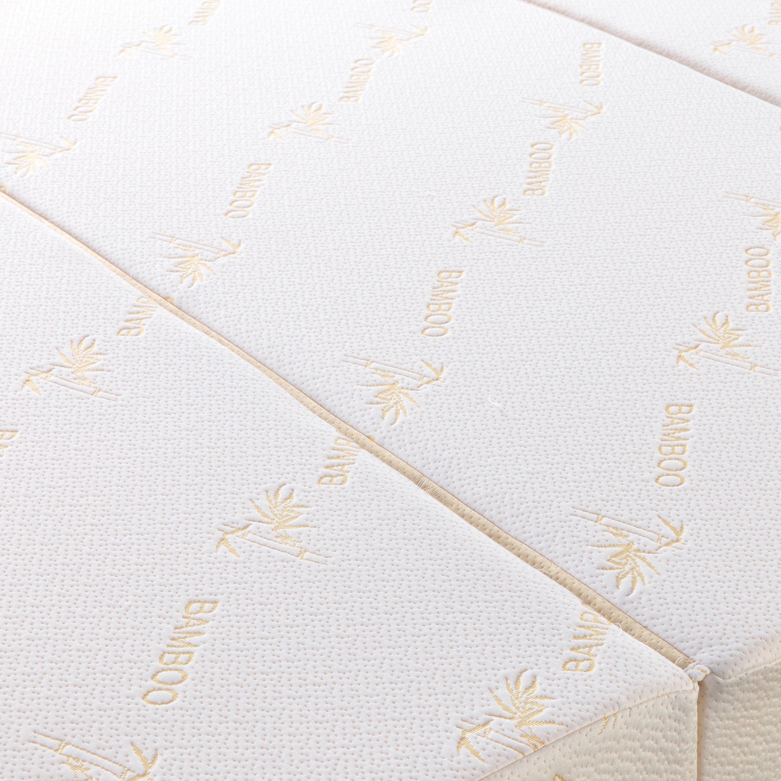 Close-up view of the Plico Bamboo Folding Foam Mattress - Queen, showcasing its linen-like fabric with a subtle pattern, emphasizing its smooth texture and sturdy foam construction for comfort and support.