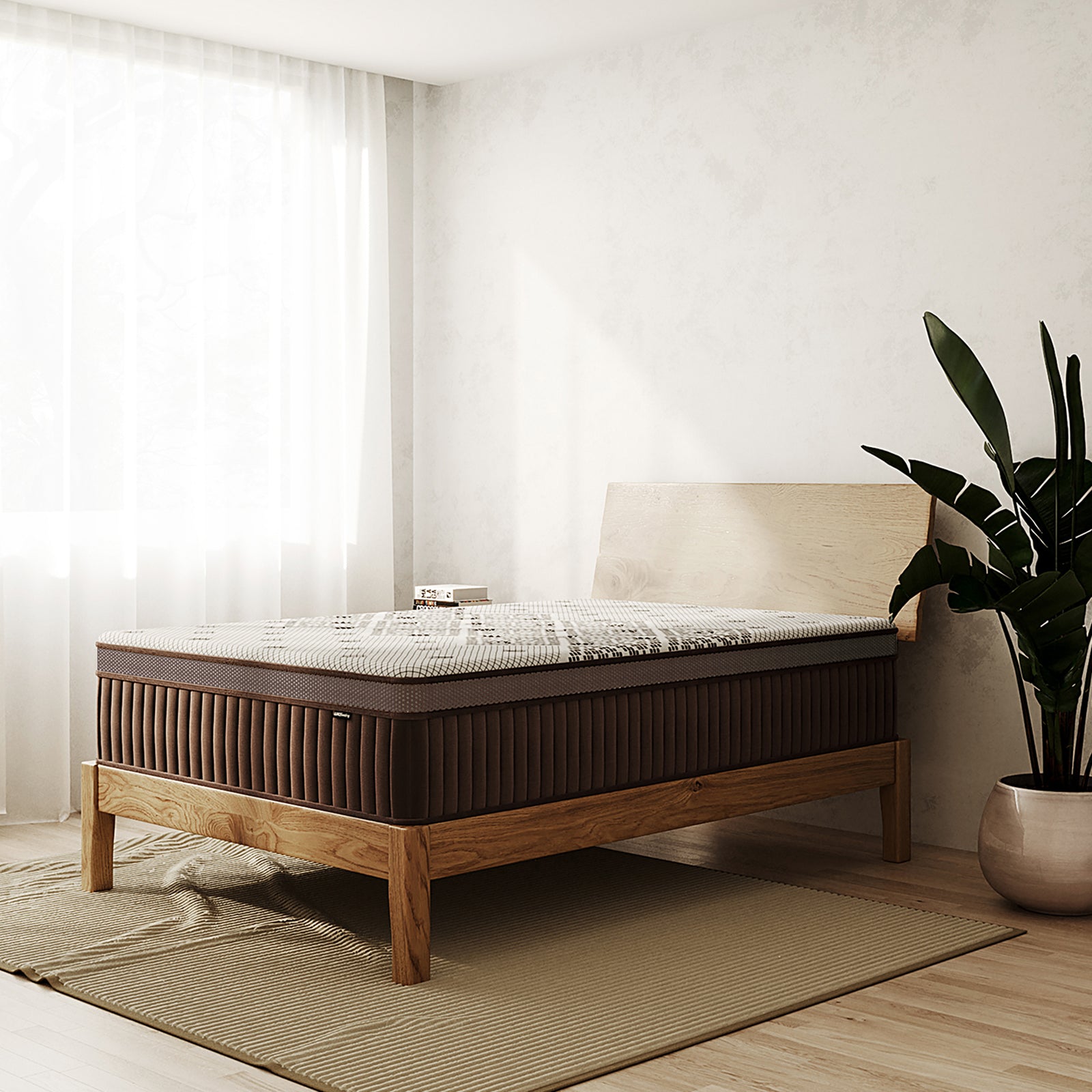Thalia Double 30cm Memory Foam Pocket Spring Mattress in Med displayed in a minimalist bedroom, featuring a brown, textured surface on a wooden frame, set on a ribbed rug, with books on the headboard.