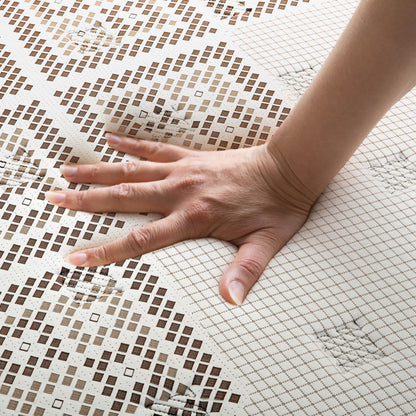 Hand pressing into the Thalia Double 30cm Memory Foam Pocket Spring Mattress, showcasing its medium firm feel and grid-patterned cover, highlighting the mattress's pressure-relieving and supportive properties.