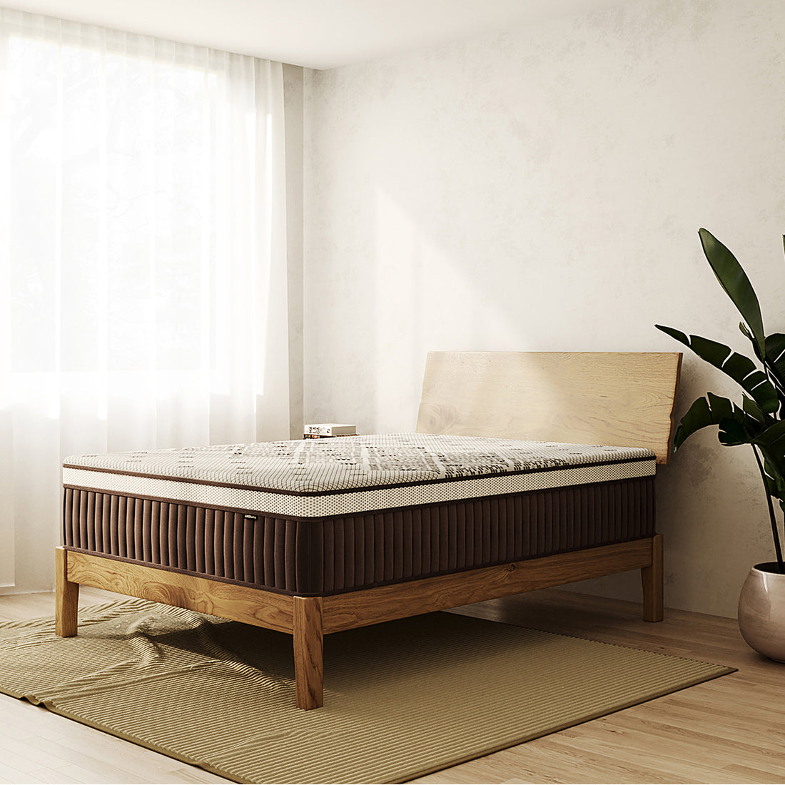 Thalia Queen 30cm Memory Foam Pocket Spring Mattress in Med, shown on a minimalist wooden bed frame in a sunlit room, features a two-tone design with a dark sidewall and patterned top.