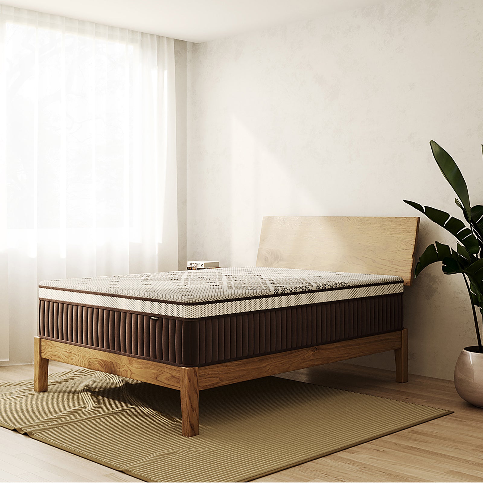 Thalia Queen 30cm Memory Foam Pocket Spring Mattress in Med, shown on a minimalist wooden bed frame in a sunlit room, features a two-tone design with a dark sidewall and patterned top.