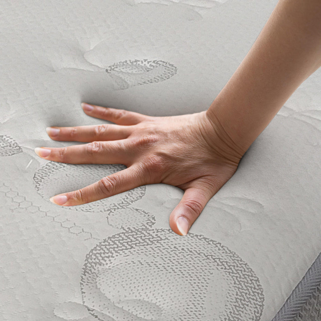 Hand pressing on Thetis Double 25cm Pocket Spring Latex Mattress in Med Firm, showcasing memory foam's indentation for spinal support, medium firmness, and responsive cushioning.