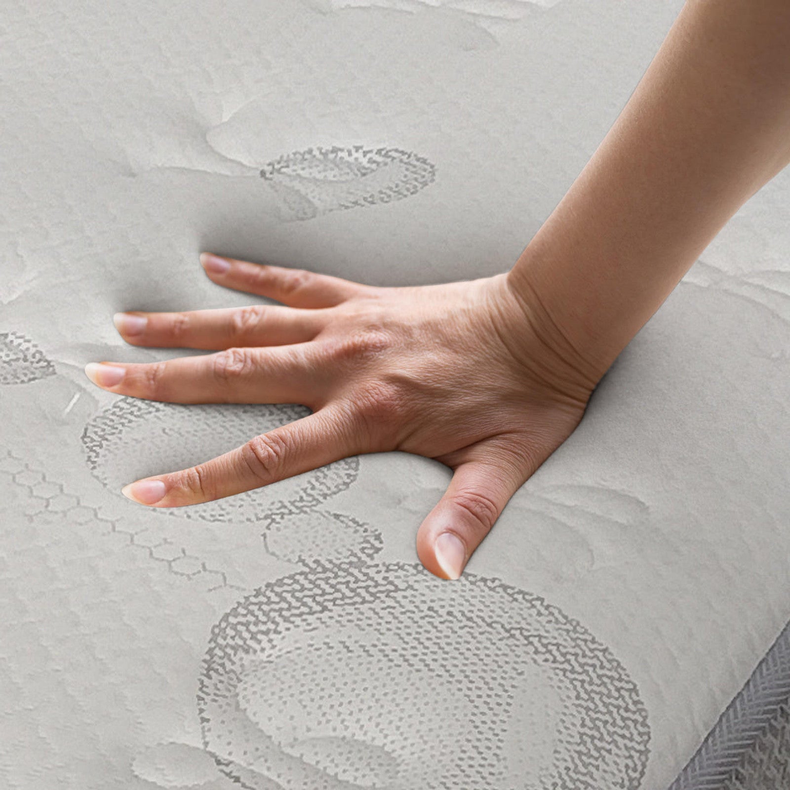 Hand pressing on Thetis Double 25cm Pocket Spring Latex Mattress in Med Firm, showcasing memory foam's indentation for spinal support, medium firmness, and responsive cushioning.