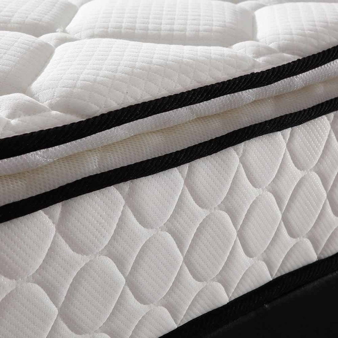 Close-up of the Luxo Venus Double Firm Pocket Spring Pillow Top Mattress, showcasing its firm foam pillow top and high-density pocket springs, designed for enhanced support and breathability.
