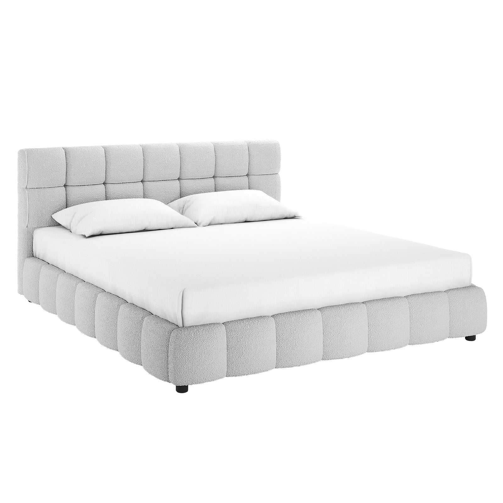 Nikias King Bouclé Fabric Bed Frame in Light Grey, featuring a low-profile platform with a tufted upholstered frame and headboard, dressed with a white mattress, linens, and two pillows.
