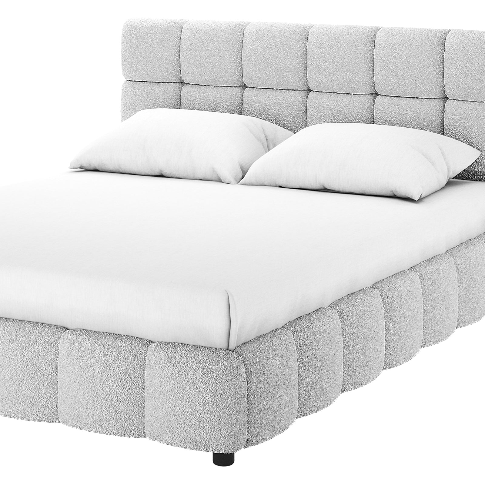 Nikias King Bouclé Fabric Bed Frame in Light Grey with a plush, grid-style headboard and tufted base, featuring a simple white sheet and pillows, viewed from a low, front-side angle.