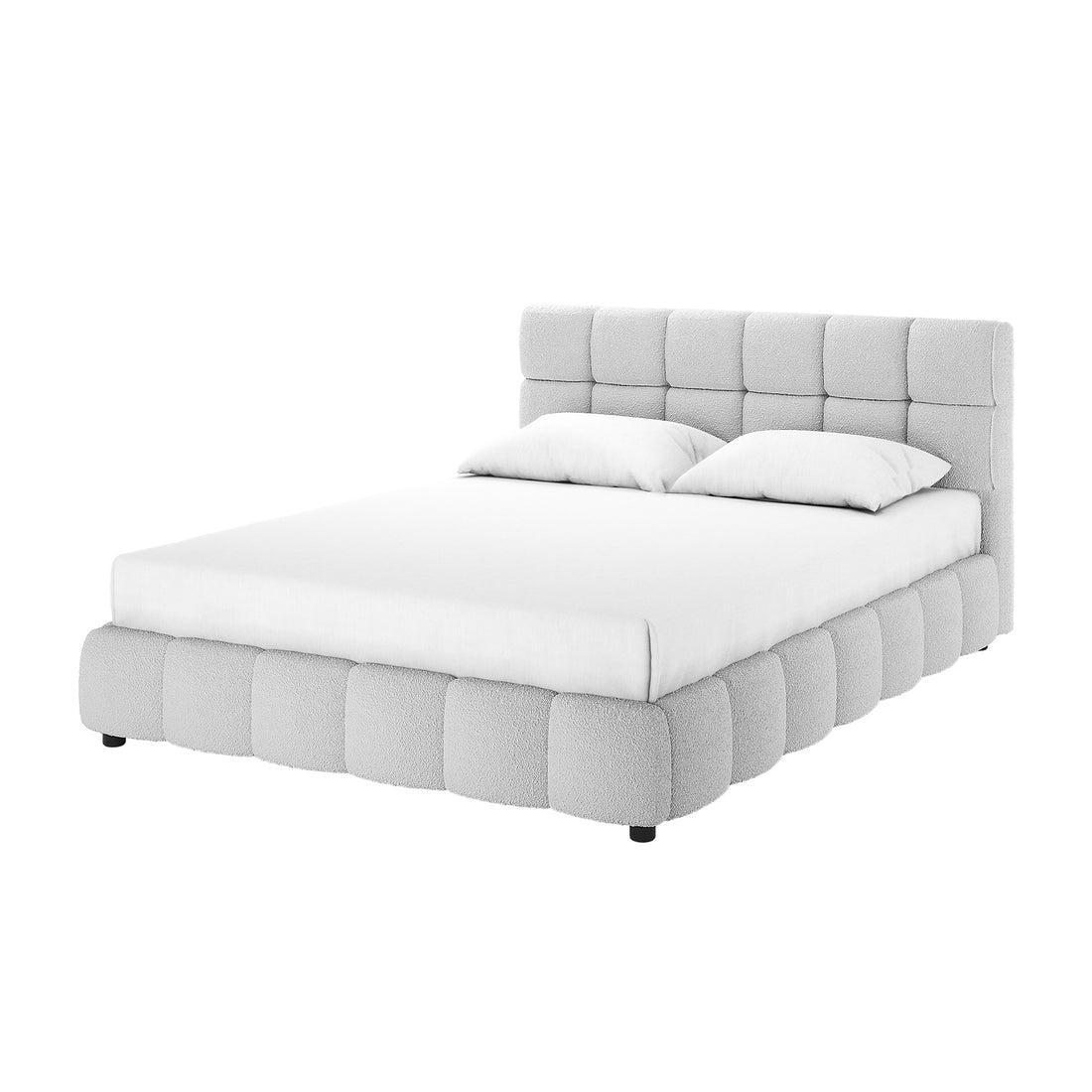 Nikias Queen Bouclé Fabric Bed Frame in Light Grey features a low-profile design with a tall, square-tufted headboard and matching pillows, all upholstered in textured light fabric, on short dark legs.