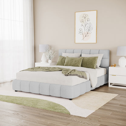 Nikias Queen Boucle Fabric Bed Frame in Light Grey features a padded, grid-panel headboard and low-profile design, complemented by neutral bedding and moss-green accents in a modern bedroom setting.