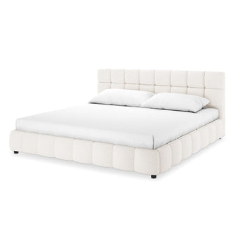 Nikias Super King Boucle Fabric Bed Frame in Cream White features a plush, grid-tufted headboard and quilted rails in luxurious bouclé fabric, complemented by a simple white mattress and pillows.