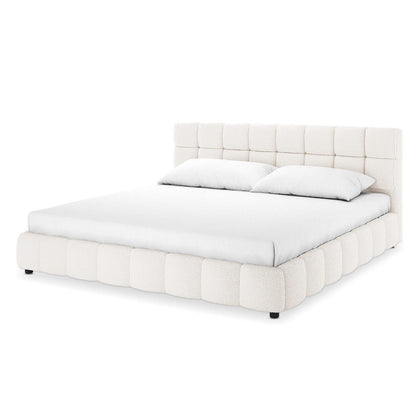 Nikias Super King Boucle Fabric Bed Frame in Cream White features a plush, grid-tufted headboard and quilted rails in luxurious bouclé fabric, complemented by a simple white mattress and pillows.
