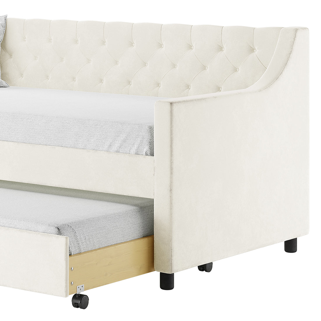 Ovidia Velvet Single Sofa Daybed with Trundle in Cream White featuring plush button-tufted upholstery, wood-toned pull-out trundle on casters, and light-gray fitted sheets on both mattresses.