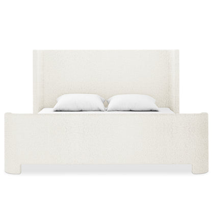 Palmira King Boucle Fabric Bed Frame in Cream White, featuring a tall headboard, low-profile sleigh design, and white boucle upholstery, with two white pillows on the mattress.